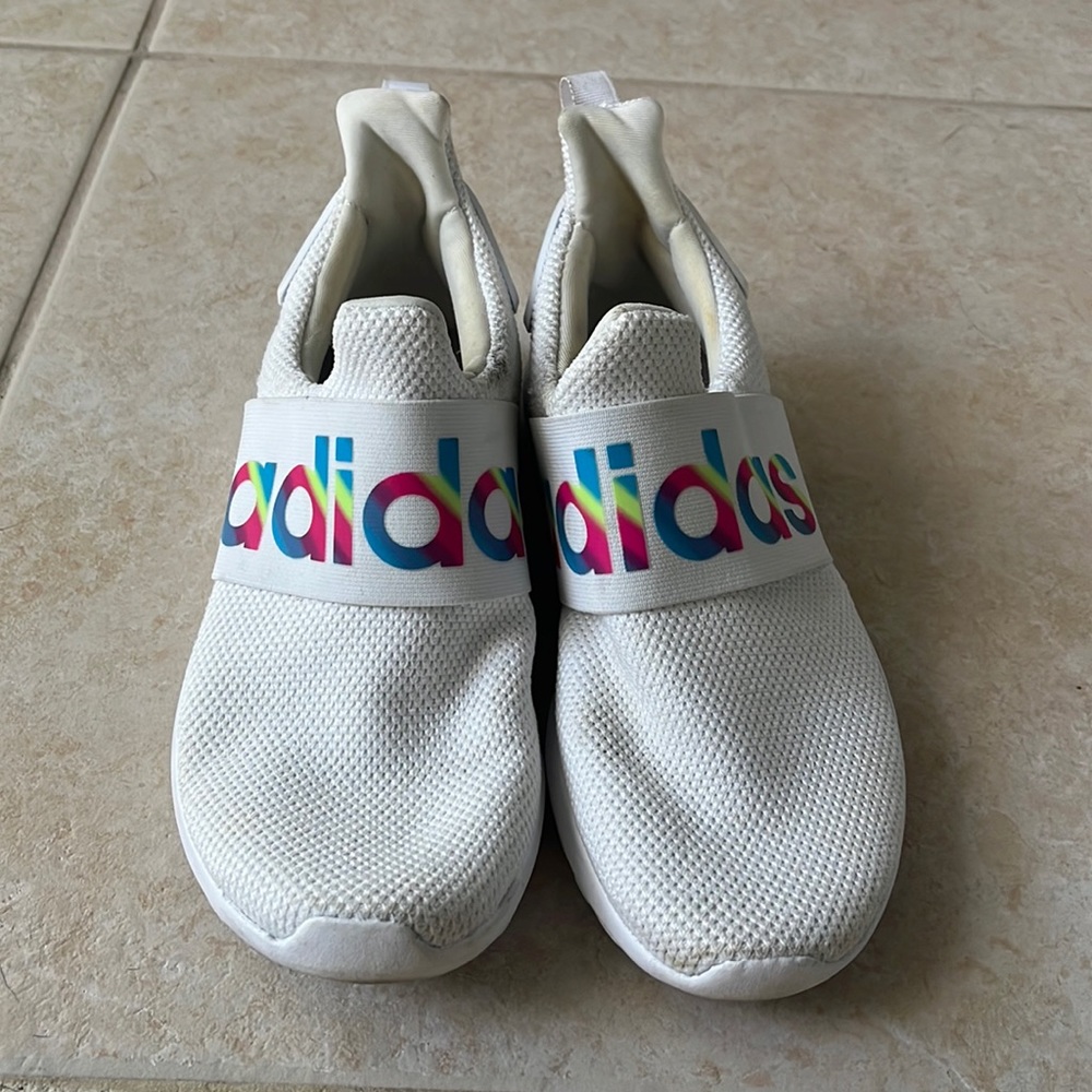 White slip on adidas sneakers